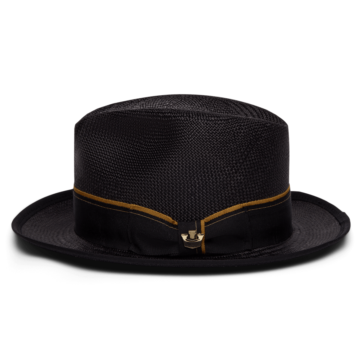 The Goorin Bros. Hartman hat is a black 100% toquilla woven style with a flat crown, slightly rounded brim with contrast edge binding, and a black band detailed with a thin gold stripe and gold clasp at the front.