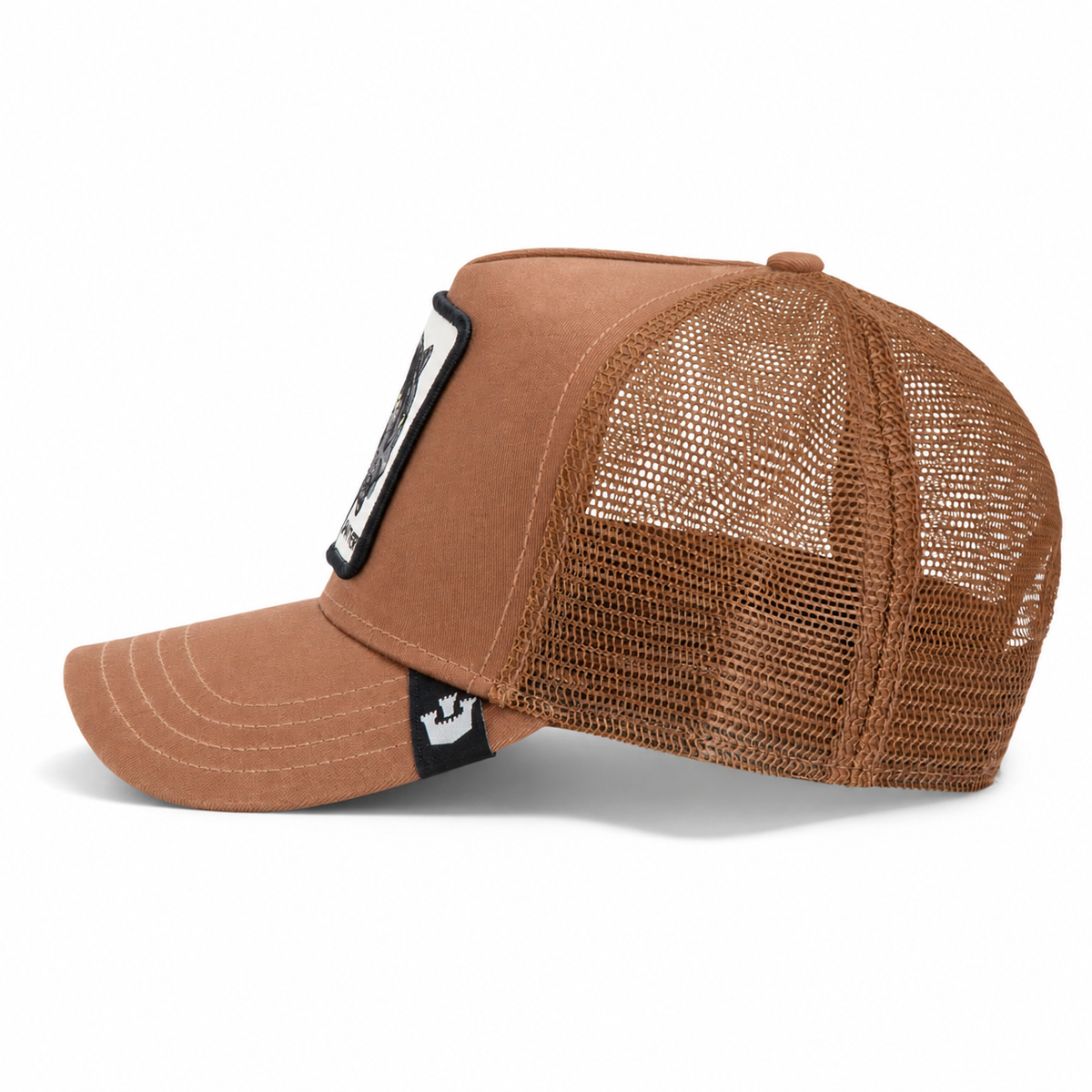 Goorin Bros. "The Panther" brown trucker hat featuring a mesh back, fabric front panels, curved brim, and a rectangular "The Farm" patch on the front.