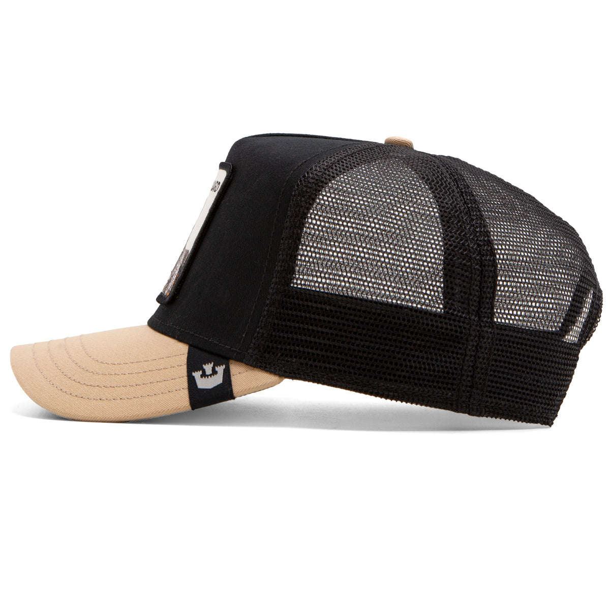 Side view of The Guard Dog trucker cap by The Farm, featuring a beige bill, black mesh back, and a front panel patch—this protective hat delivers a commanding presence while staying true to classic style.