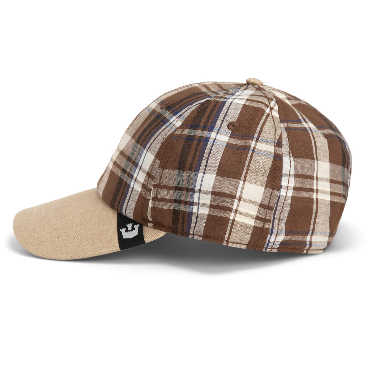 Goorin Bros. “Ask Your Mother” Papa Cap in brown and beige plaid, featuring a curved brim and a small black tag on the back. This relaxed hat is shown angled to display its left side.
