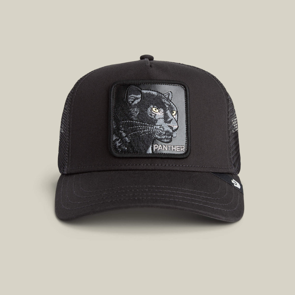 The Goorin Bros. Panther Trucker in VOID is a classic black mesh-back hat featuring a front patch with an embroidered panther and the word "PANTHER" underneath.