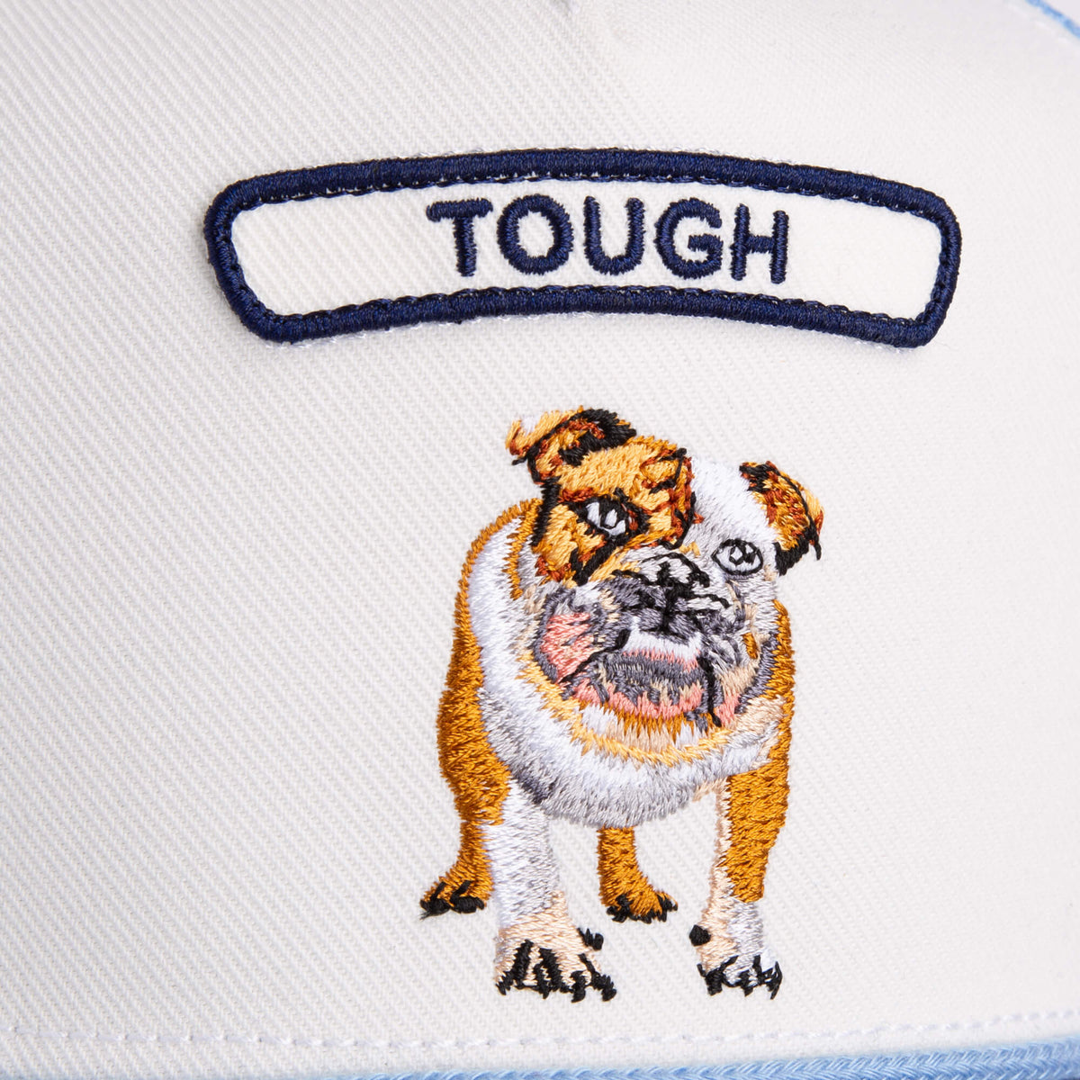 The Goorin Bros. Pop Rocker Bulldog is a white fabric trucker hat featuring an embroidered bulldog and a "TOUGH" patch above it.