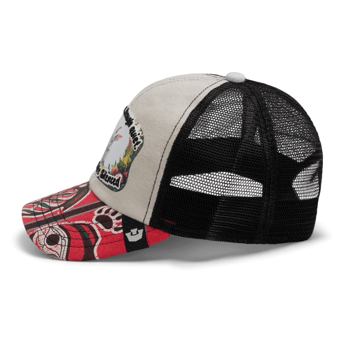 The Lil Ronin trucker by Goorin Bros. from our Storybook collection features a beige front, black mesh back, red patterned bill, and a bird-and-landscape patch—crafted in part from recycled tee shirts.
