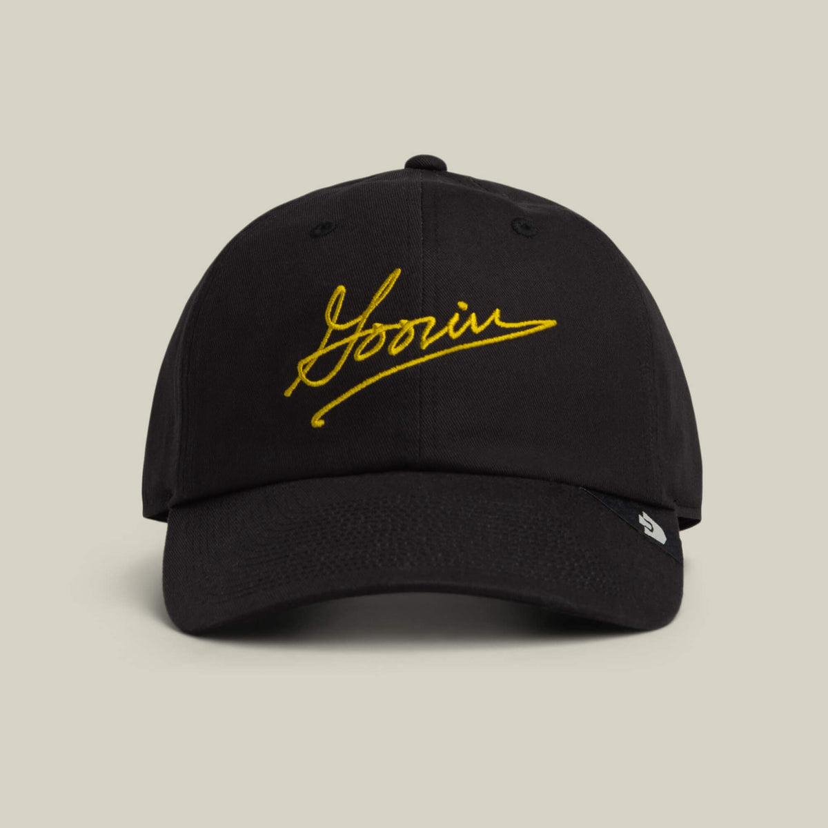 The Goorin Script Papa cap by Goorin Bros. comes in VOID, featuring “Yoonin” embroidered in yellow script on the front—a classic accessory with signature style.