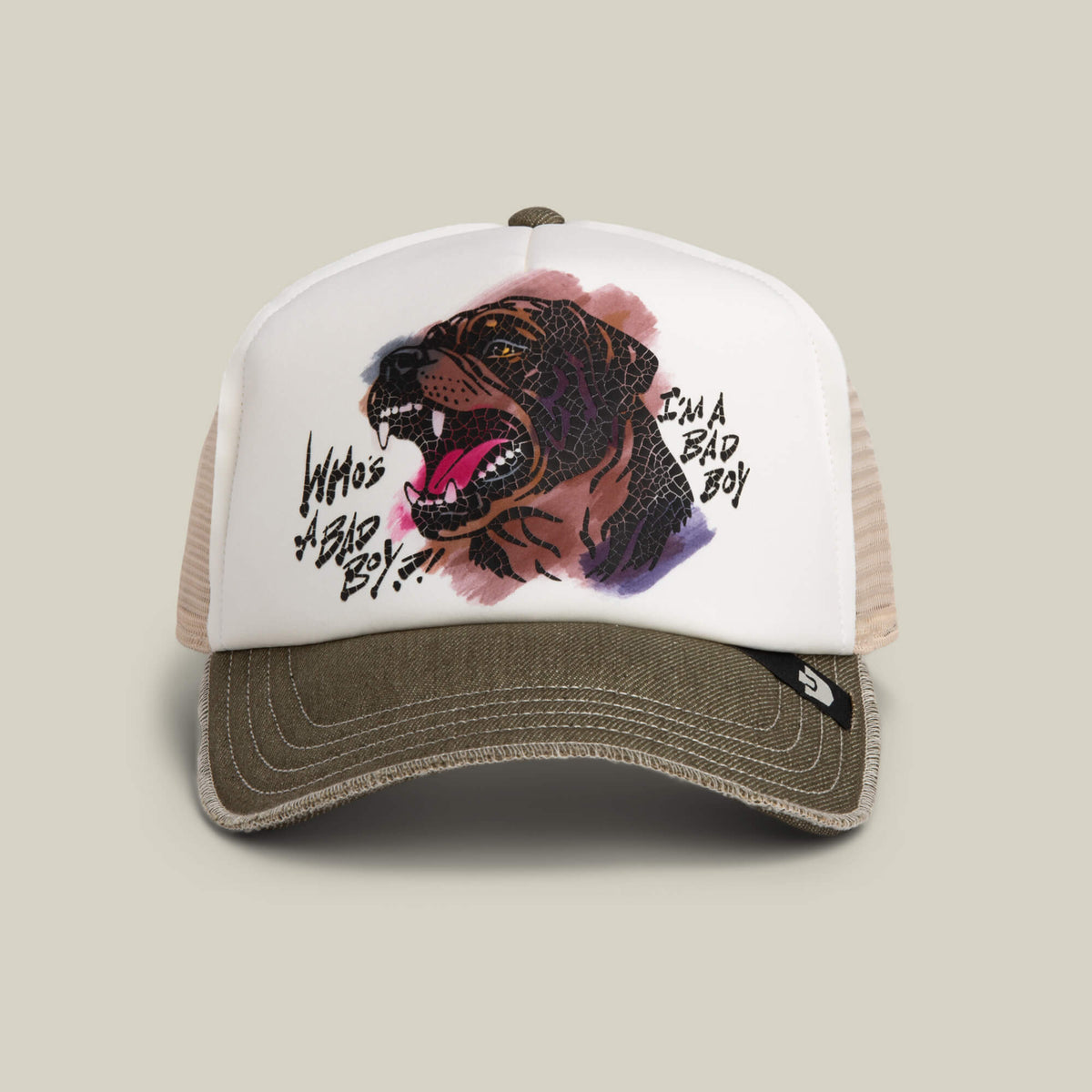 The Bad Boy Disruption trucker hat by Goorin Bros. features a hand-illustrated snarling Rottweiler and “WHO’S A BAD BOY?”/“I’M A BAD BOY” text on a white front panel, finished with a biscuit-colored bill.