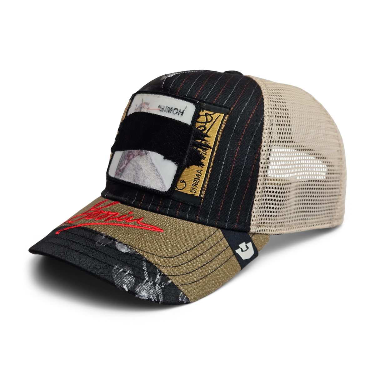 The Goorin Rework Trucker by Goorin Bros. is a limited edition trucker cap featuring a black and beige mesh back, patchwork design, red brim text, and unique stitched and printed patches made from recycled fabrics.