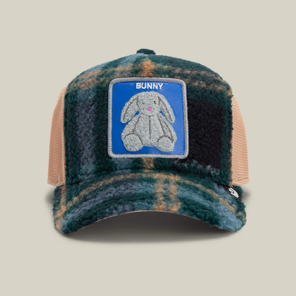 The Double Stuffed - Bunny hat by Goorin Bros. features a multi-color plaid design with mesh sides and an adjustable snapback for a comfortable fit. A plush chenille patch on the front displays a gray stuffed bunny labeled "BUNNY" against a blue background.