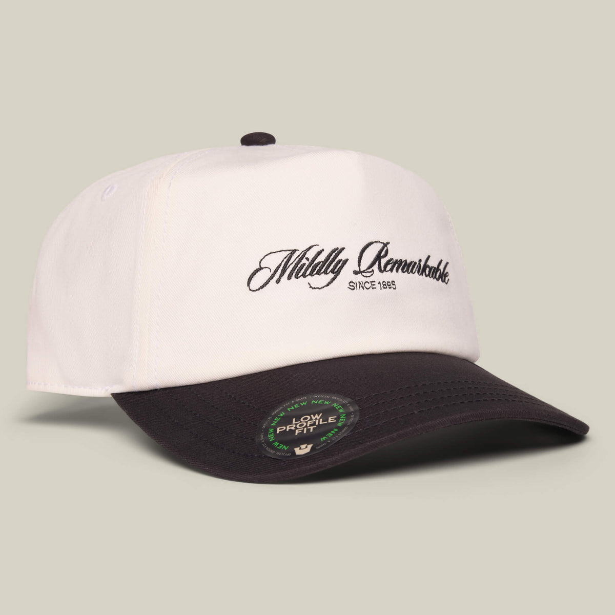 The Goorin Bros. Mildly Remarkable Script hat features a white and black design, "Mildly Remarkable Since 1985" in classic script embroidery on the front, and a Low Pro Fit sticker on the brim.