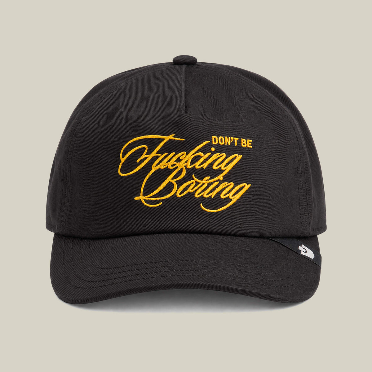 The Goorin Bros. "Don't Be Fucking Boring" hat in Void features gold script embroidery on the front.