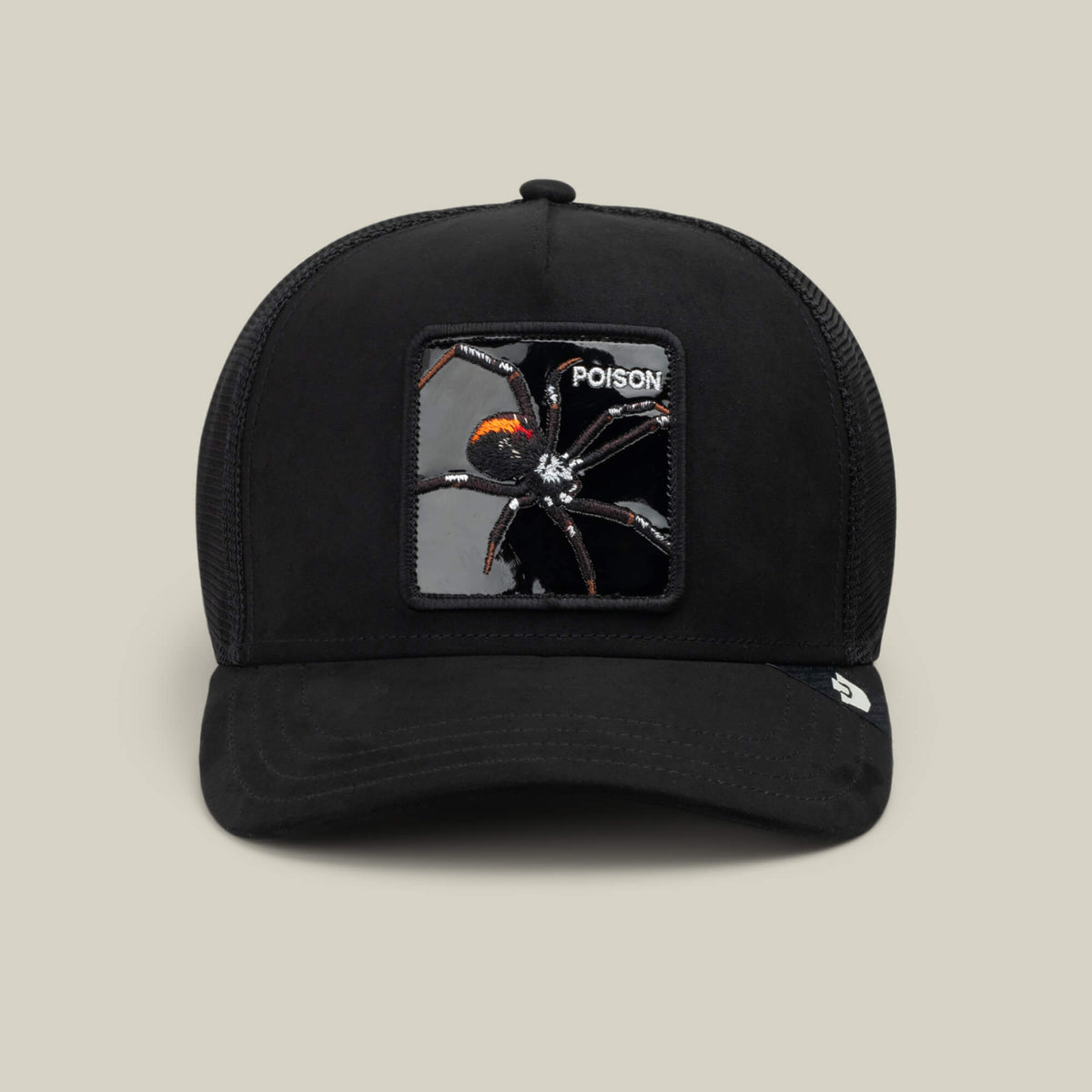 Experience blackout hat style infused with spider energy in the Goorin Bros. "Black Out Spider" trucker hat, featuring a Void colorway, a mesh back, and a rectangular collectible animal patch of a black widow spider labeled with the word POISON on the front. Photographed on a plain beige background.