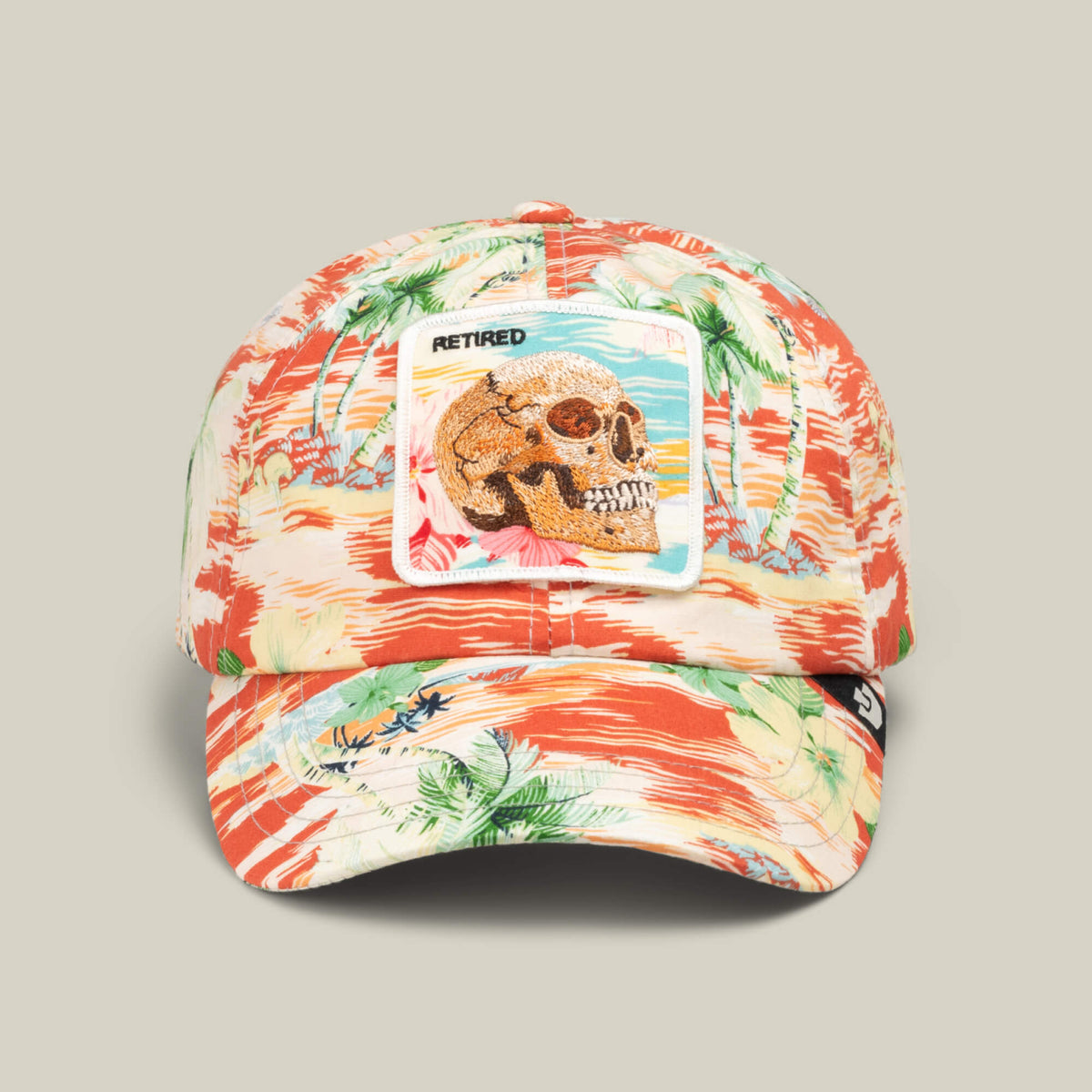 Fresh Friday drop: The Goorin Bros. "Funemployed Forever" papa cap in Rush Red features a vibrant tropical pattern and a front patch with a skull, sunglasses, and RETIRED—perfect for the forever funemployed lifestyle.