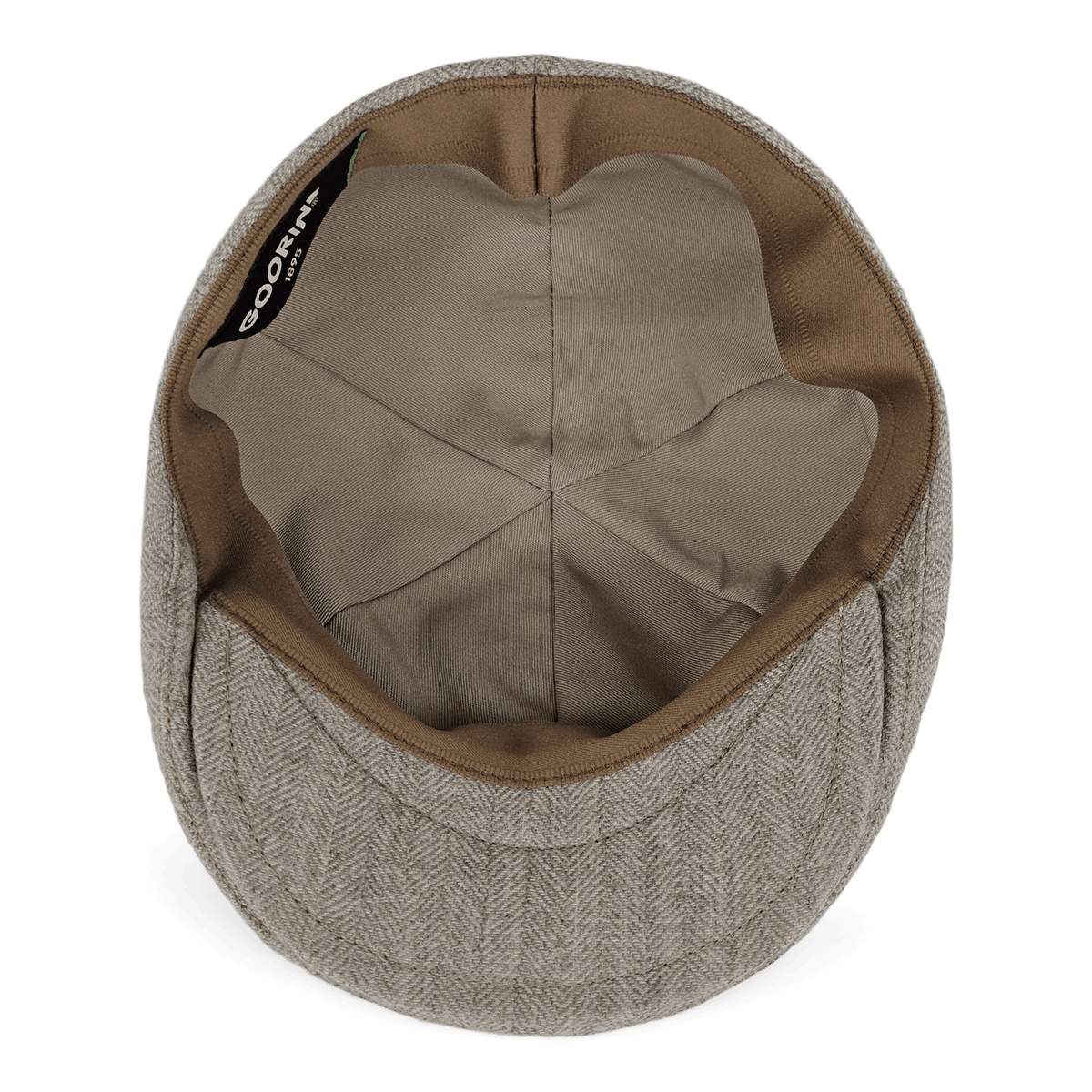 The Goorin Bros. Harry Bones flat cap in beige herringbone is shown from the inside, highlighting its fabric lining and inner seams—a fine example of wool headwear made in the USA.