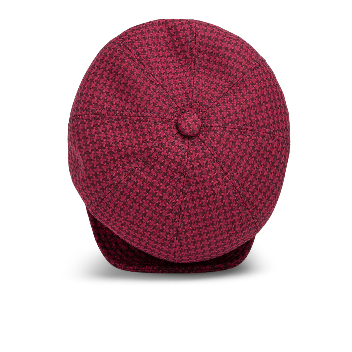 A maroon and black houndstooth Goorin Bros. Cold Snap cabbie flatcap is viewed from above, displaying the button on top and the partially visible brim at the bottom. Made in America, this cap features a comfortable German wicking sweatband for all-day wear.