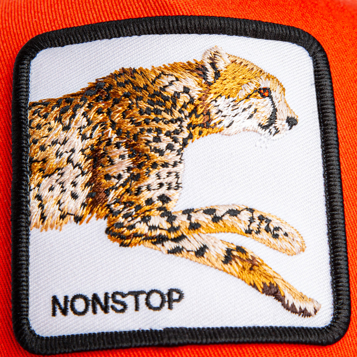 Add bold style to any kids cap or orange crown with The Nonstop Cheetah Mini Noir by Goorin Bros.—an embroidered patch featuring a running cheetah and the word NONSTOP on an orange fabric background.