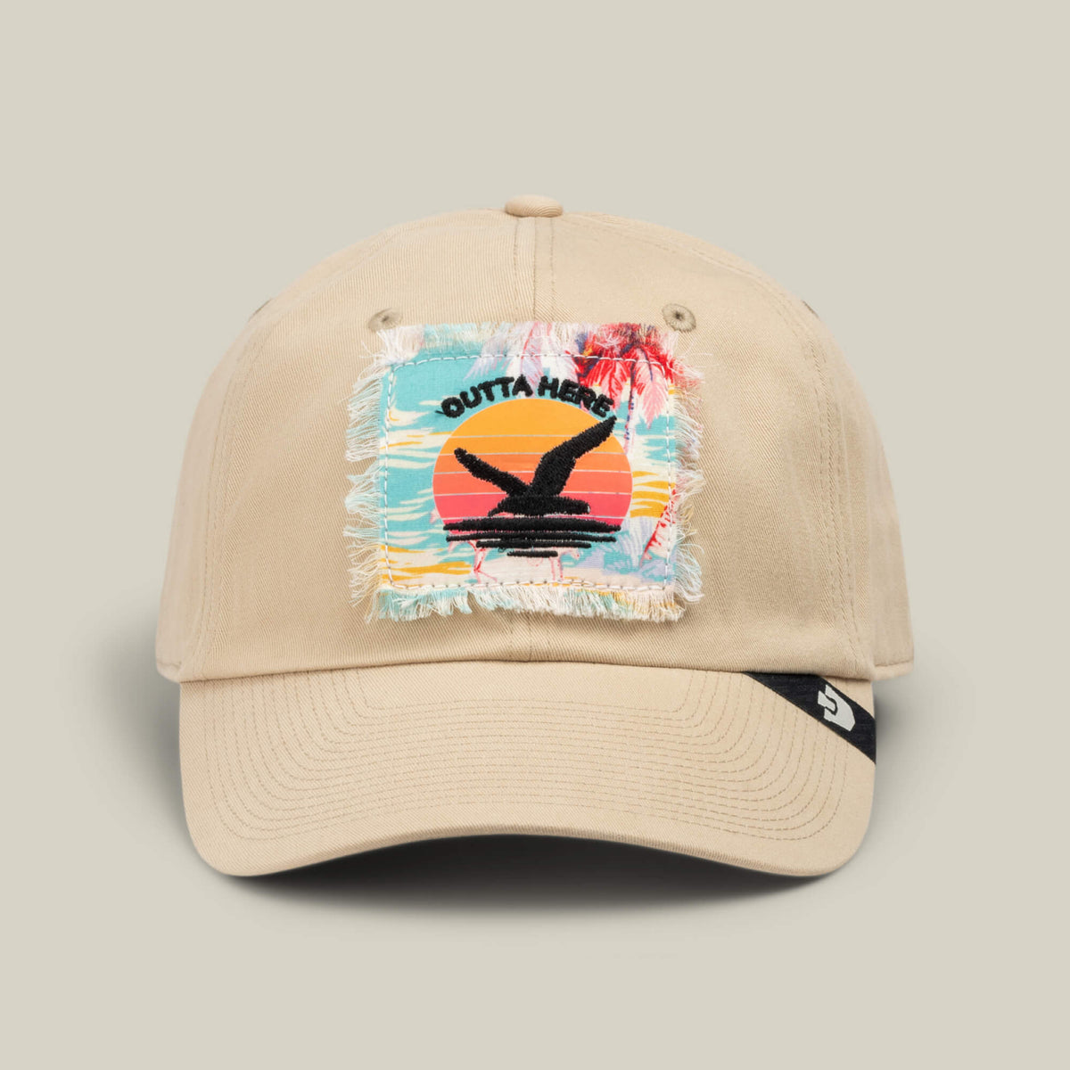 The “GTFO” cap by Goorin Bros. features a beige design with a frayed patch depicting a sunset, palm trees, and the words “Outta Here” above a black bird silhouette—just the thing for channeling those S.O.S. Island vibes, whether you’re off to the mess hall or simply daydreaming about your next adventure.