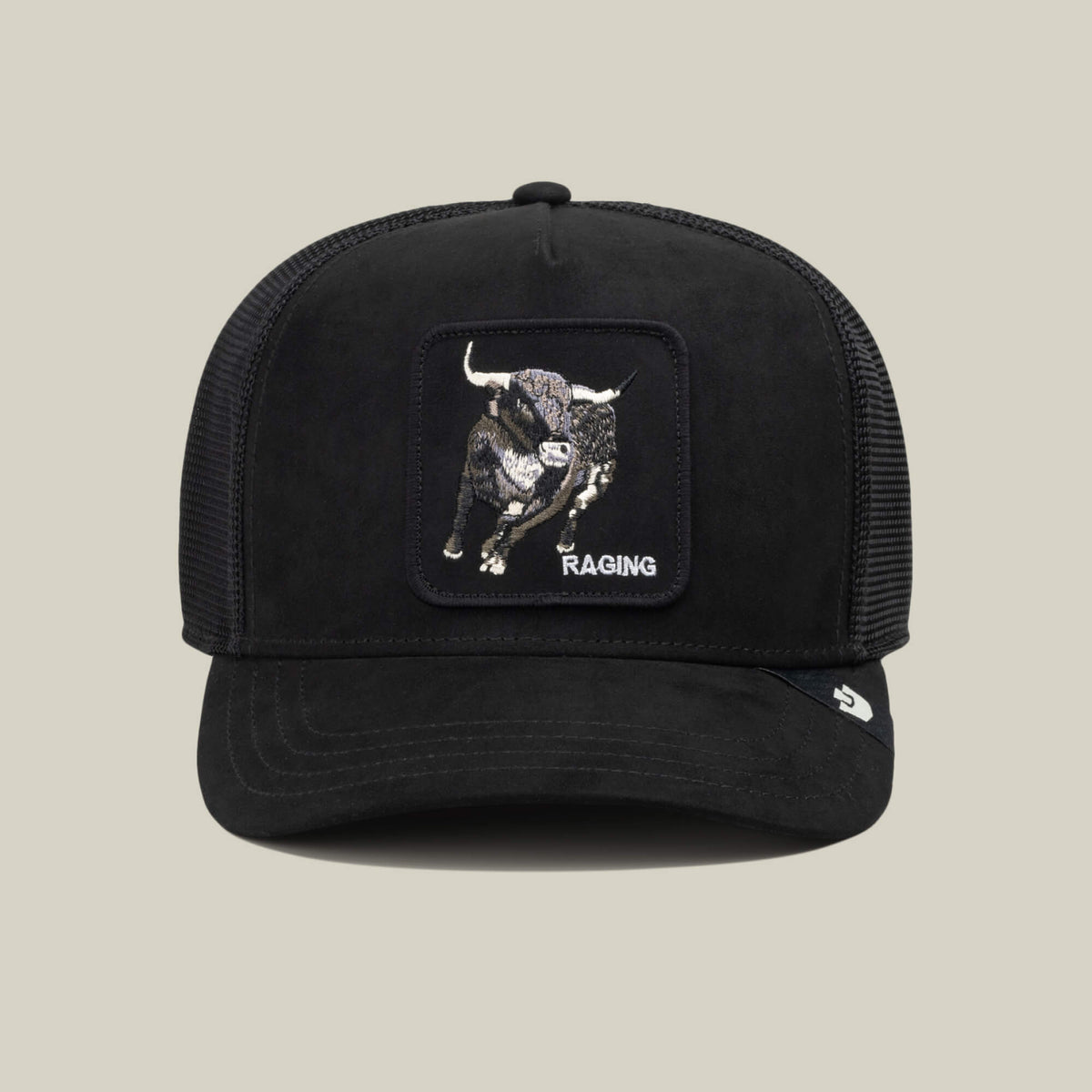 Black mesh trucker hat crafted from durable polyester, featuring a patch with an embroidered Suede Bull and the word “Suede” on the front, displayed on a plain beige background—a bold accessory by Goorin Bros. to complement your athletic wear.