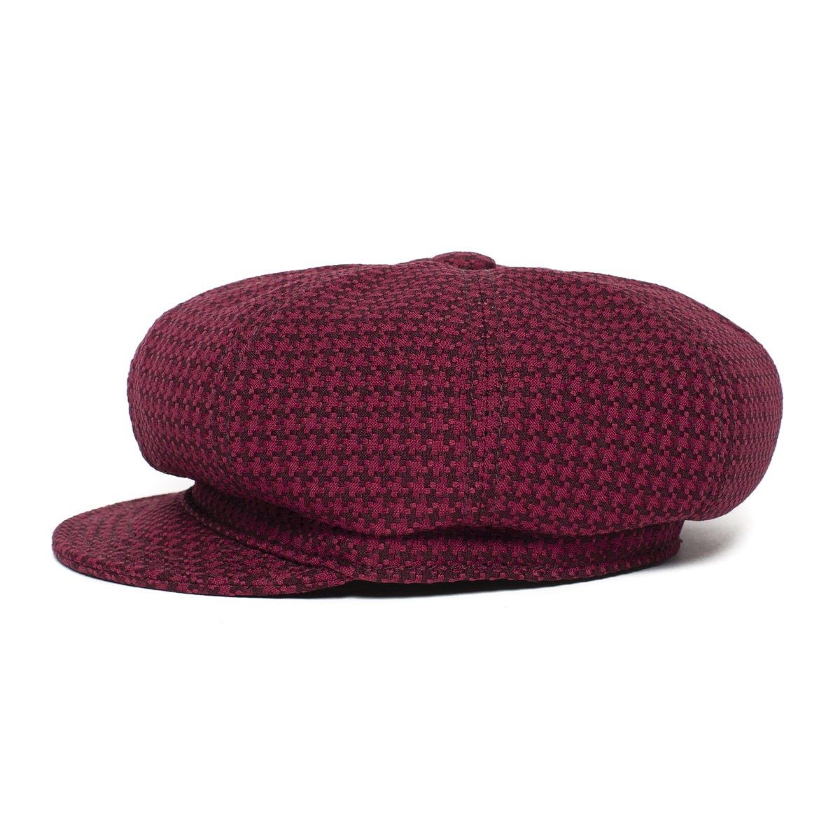 The Goorin Bros. “Cold Snap” cabbie flatcap is displayed on a white background, showcasing its burgundy and black houndstooth pattern and featuring a German wicking sweatband for enhanced comfort.
