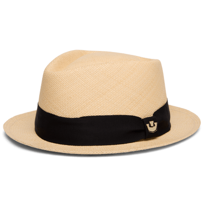 The That's All Folks hat by Goorin Bros. is a genuine Panama, handwoven in Ecuador, with a light hue, wide black ribbon band, and a small decorative pin on the side.