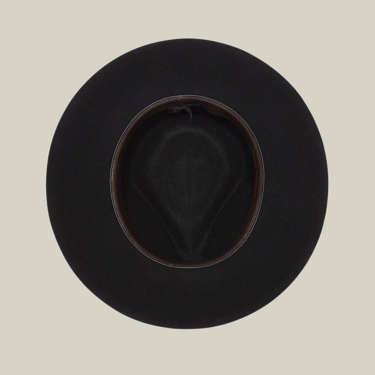 The Goorin Bros. Colonel Pierce is a black wide-brimmed hat pictured from above, highlighting its inner lining and oval opening against a simple light background.