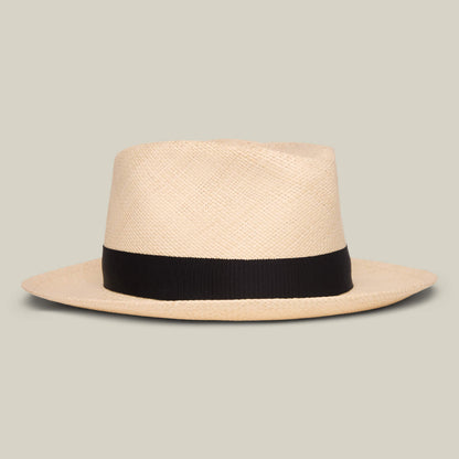 The Goorin Bros. John Sr. is a beige toquilla teardrop fedora with a wide black band and 50 UPF sun protection, shown against a plain light gray background.