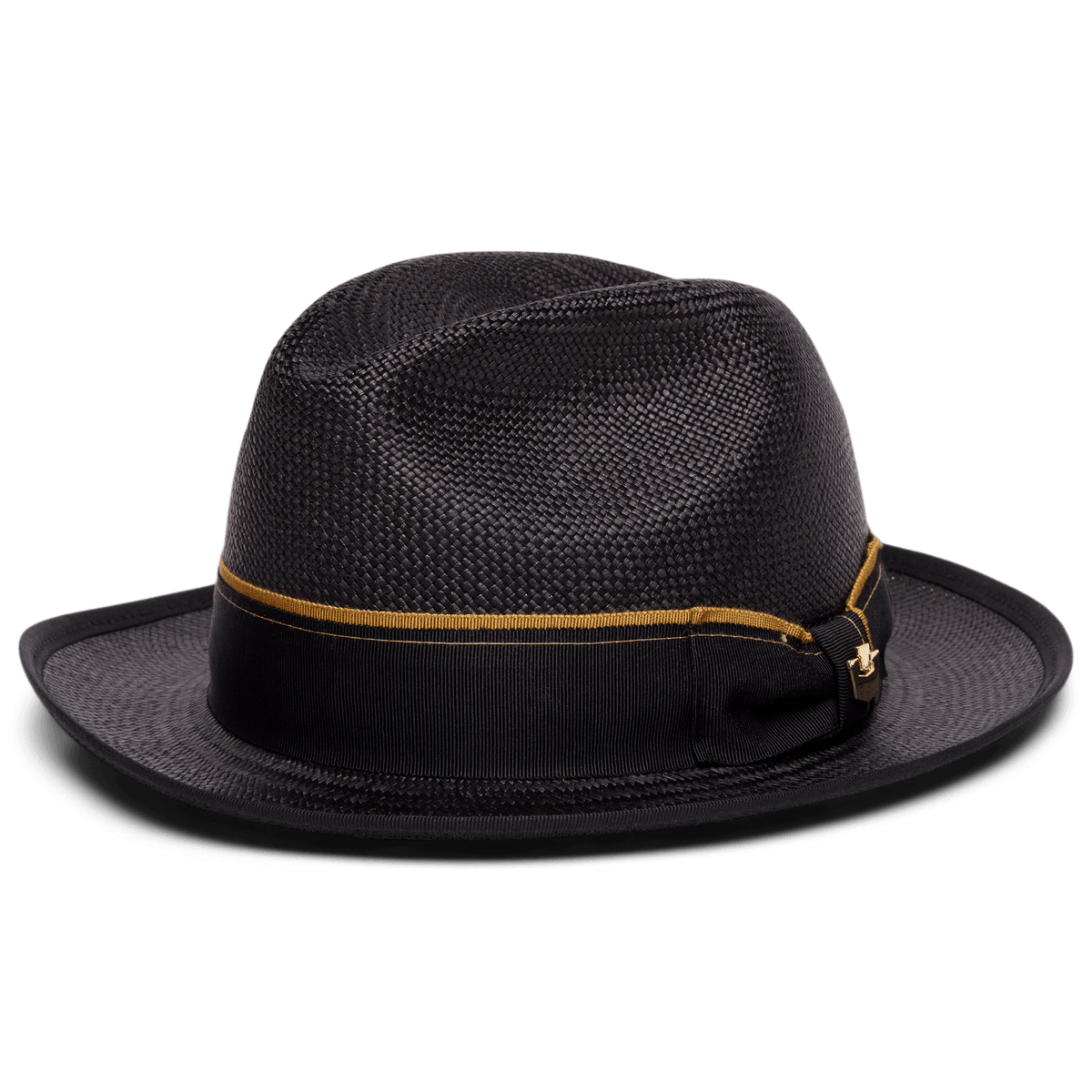 The Hartman by Goorin Bros. is a black fedora hat crafted from 100% toquilla, featuring a gold and black grosgrain band with a small decorative side bow, shown on a white background.