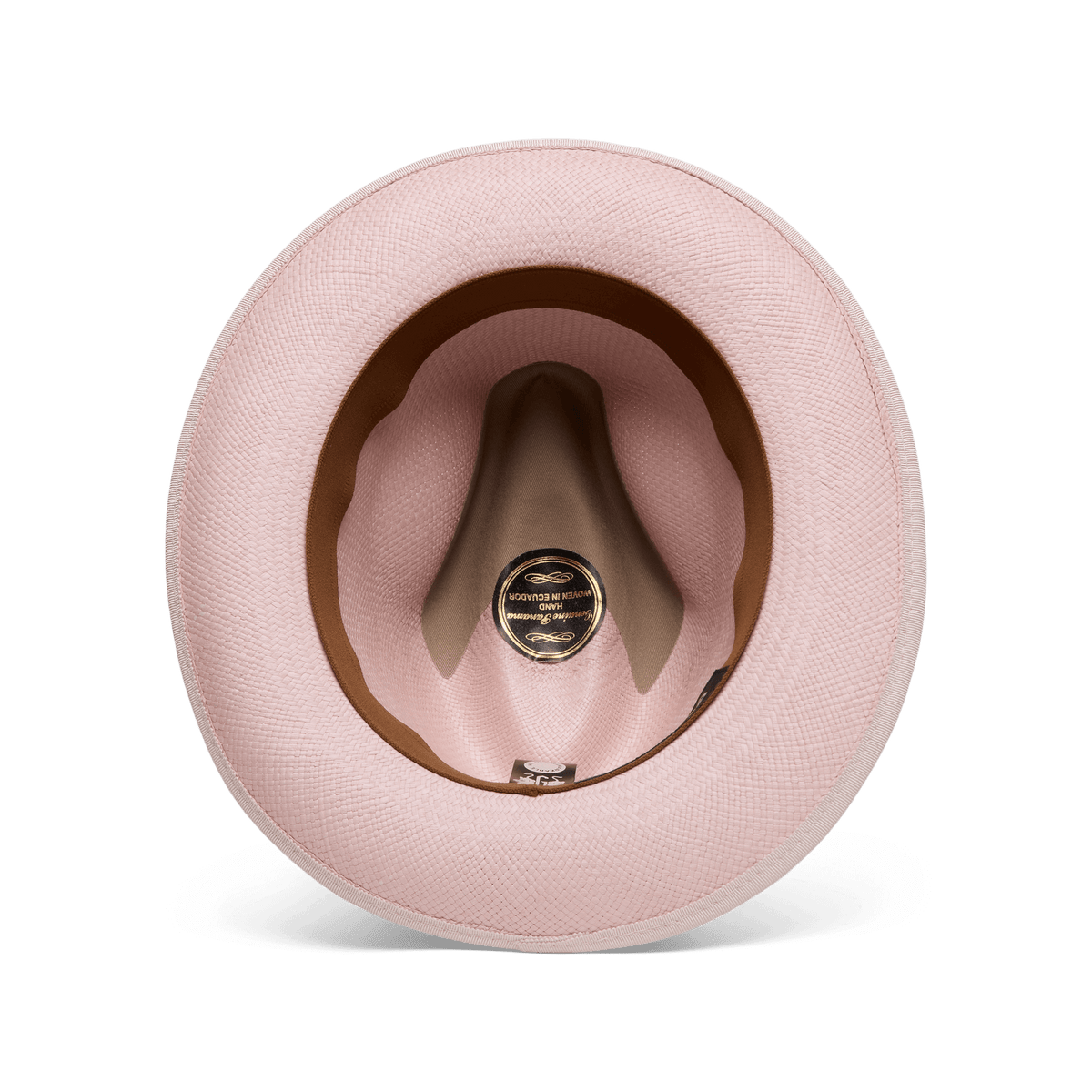 A top-down view of the Hartman by Goorin Bros., a pink hat showcasing its interior with a brown grosgrain hat band, contrast edge binding, and a black and gold label at the center.
