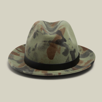 The Goorin Bros. "Dean the Butcher" fedora in camouflage is American-made, features a black grosgrain hatband, and is displayed against a plain beige background.