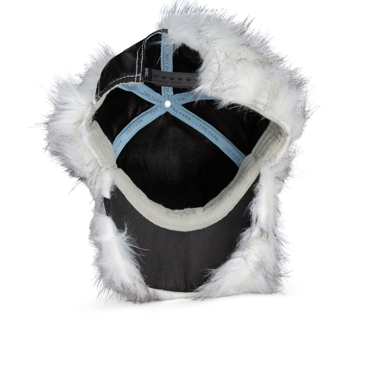 Goorin Bros. Faux Fox black baseball cap featuring white faux fur trim, shown from the back to highlight the adjustable strap and interior details—a bold fashion accessory inspired by the whimsical style of the Faux Fox hat.