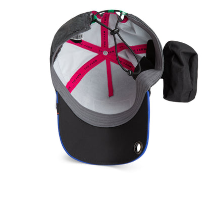 Top view of The Farm’s Oversized Package hat reveals its inner branding labels, elastic adjustment band, and a grey brim accented with a blue edge. Designed with an extra-wide brim and a side-attached black pouch, this water-resistant cap delivers both durability and functionality for everyday adventures.