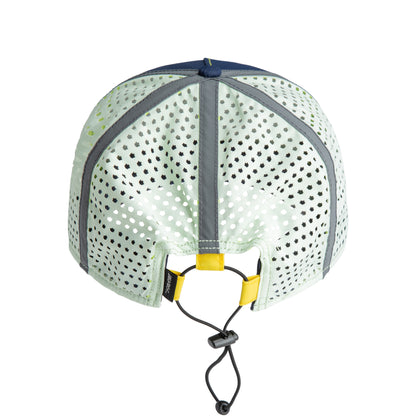 Back view of The Farm’s High Beams hat in light green, featuring perforated reflective fabric with reflective stripes, a navy blue top, yellow accents, and an adjustable drawstring closure. This water-resistant hat combines stylish design with practical functionality.