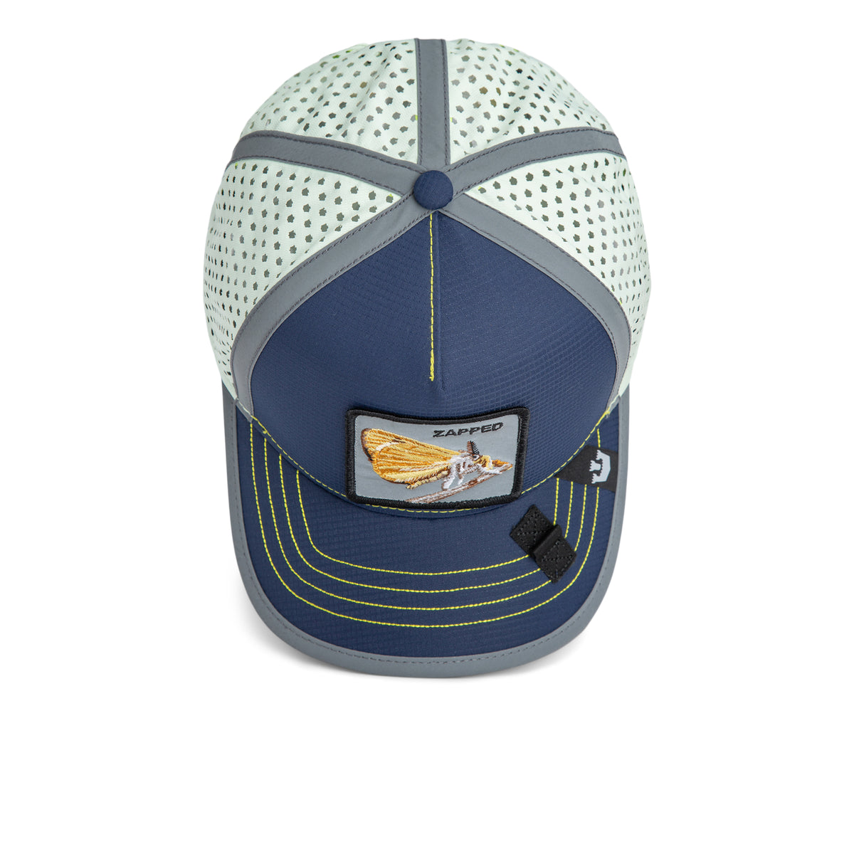 Introducing the High Beams cap by The Farm—a blue and white mesh baseball hat featuring a playful polka dot pattern, a front patch showcasing a fly with “ZAPPED” text, and neon yellow stitching along the brim. Water-resistant and adventure-ready, it blends bold style with everyday practicality.