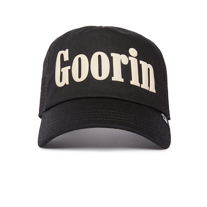 Soft Pack black trucker hat by Goorin Bros., featuring the brand name in large white letters on the front and photographed against a white background—a mildly remarkable accessory to elevate any casual look. Please note: All sales are final.
