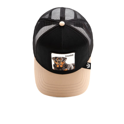 The Farm’s The Guard Dog is a black and beige mesh trucker hat featuring a front patch with a Rottweiler illustration and the word “GUARD.” Inspired by the breed’s loyal, commanding presence, this protective hat is perfect for those who value both style and confidence.