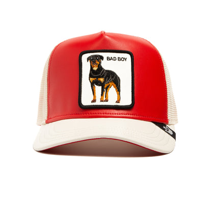 The Shleather Boy trucker hat by The Farm is a bold red and white accessory featuring a patch of a Rottweiler and the text BAD BOY on the front panel, bringing tough style to any look.
