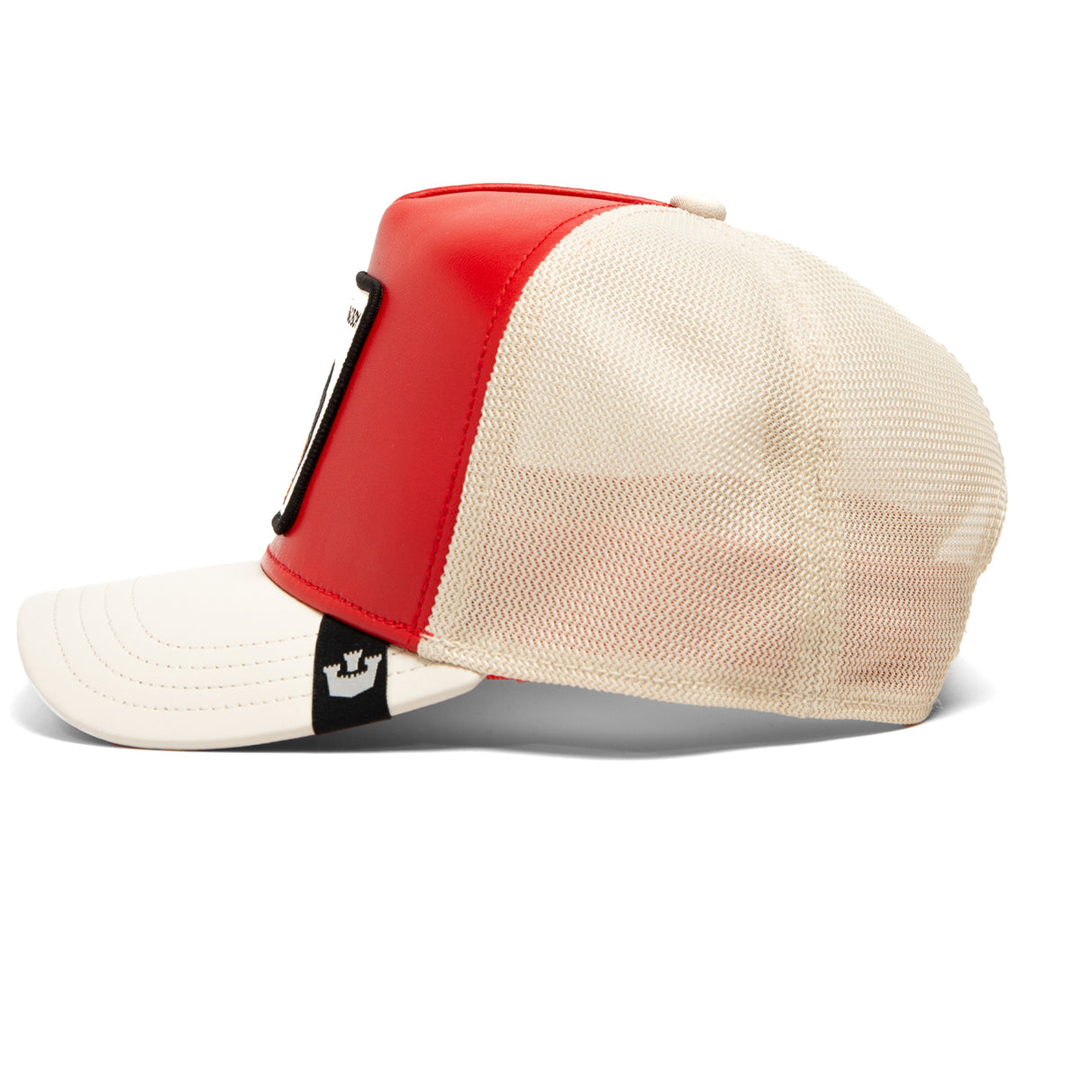 Side view of The Farm’s “Shleather Boy,” a red and white trucker hat featuring a mesh back and a black rectangular patch on the front—an ideal fashion accessory for anyone seeking tough style.