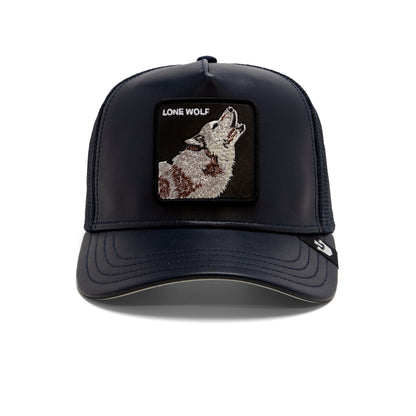 The Shleather Wolf trucker hat by The Farm features a dark blue design with a front patch depicting a howling wolf and the words “LONE WOLF,” photographed against a white background—a stylish choice for those who appreciate stealthy, on-trend fashion.