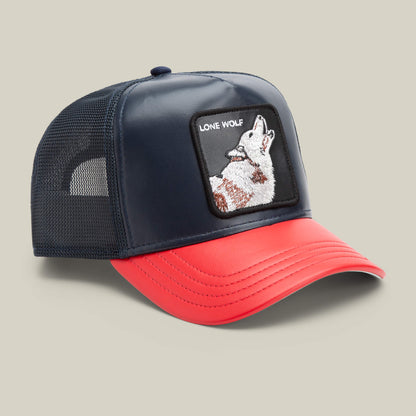 The Farm’s Shleather Wolf trucker hat features navy and red panels, a mesh back, and a front patch with a howling wolf and "LONE WOLF" text—a bold style choice for those who stand out.