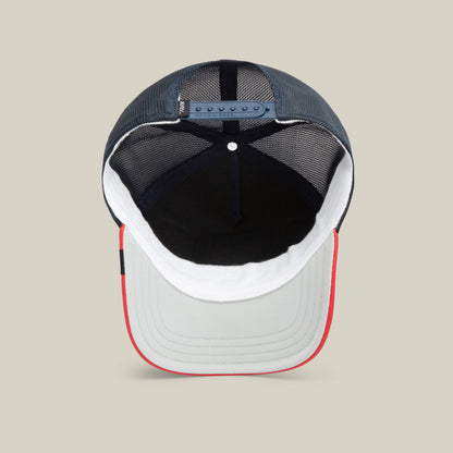 A look inside The Farm’s Shleather Wolf: a mesh trucker cap featuring a gray brim, red edge, white front panel, black interior, and adjustable snapback closure—designed for bold, fashion-forward style.