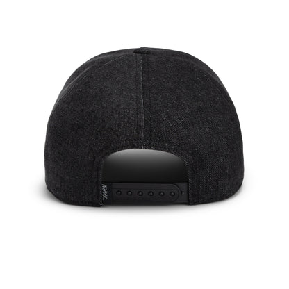 Back view of the Goorin Bros. “Smoke Signal” black, stonewashed snapback cap featuring an adjustable strap and a curved opening above the strap.