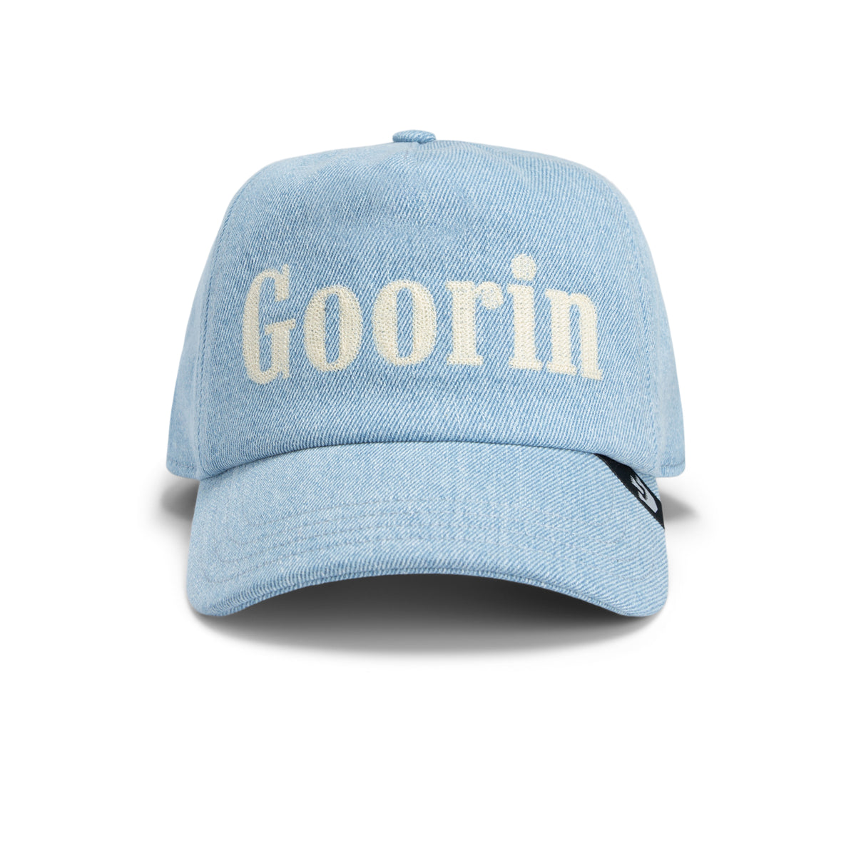 Light blue, stonewashed denim baseball cap called “Smoke Signal” by Goorin Bros., with the word “Goorin” in large white letters on the front, photographed against a white background.
