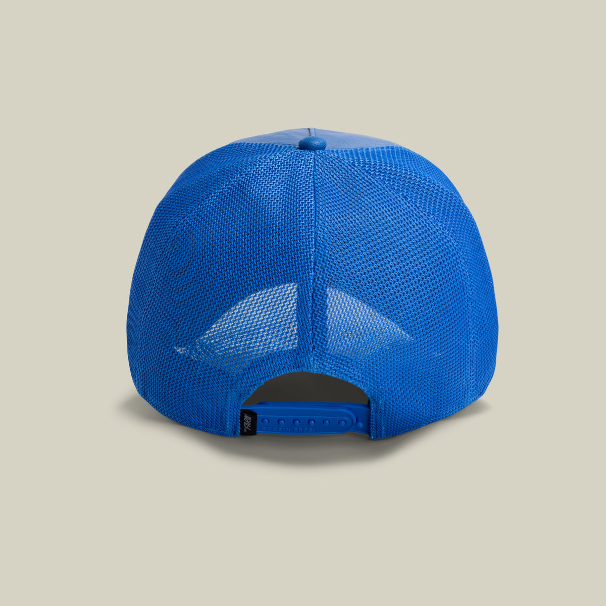The Farm's "Deep Blue Fury" mesh trucker cap is shown from the back with an adjustable snapback, on a plain light background. All sales are final.