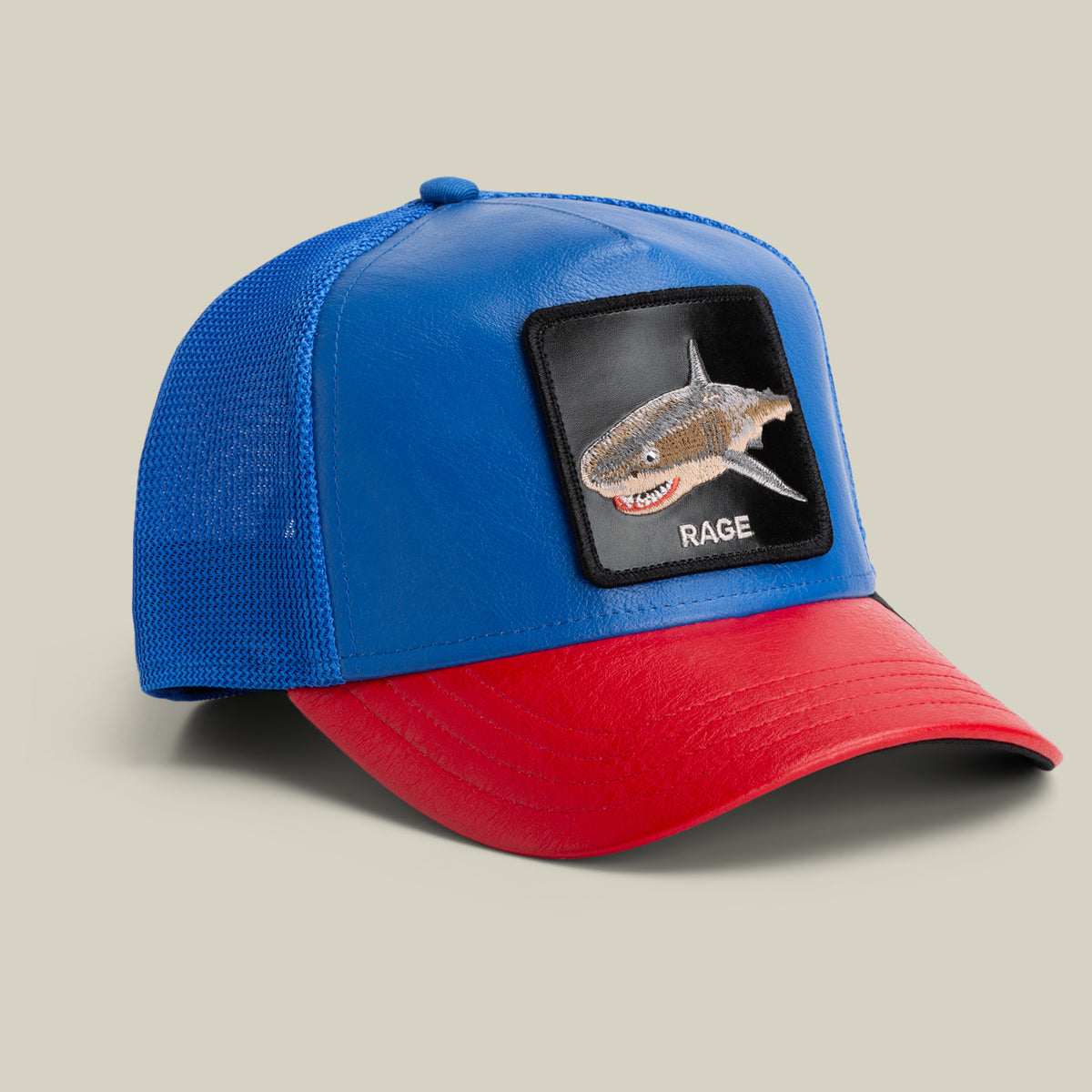 The Farm Deep Blue Fury cap features a blue and red design with a mesh back, shark patch, and "RAGE" on the front. All sales are final.