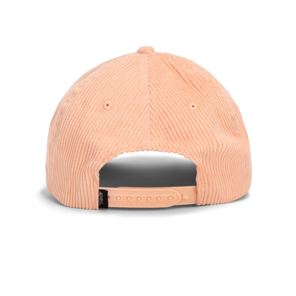 Peach-colored wide wale corduroy The Clubhouse cap by Goorin Bros., shown from the back, featuring an adjustable plastic snap closure—a subtle nod to quiet luxury.