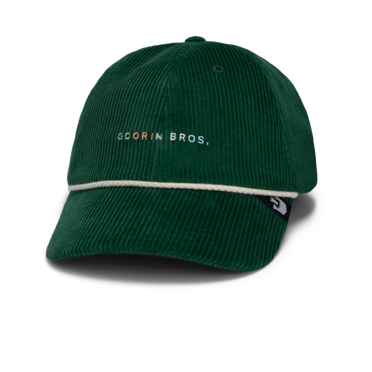 The Clubhouse by Goorin Bros. is a dark green wide wale corduroy Papa Cap, featuring Goorin Bros. text on the front and a white accent line above the brim, bringing a touch of quiet luxury to your everyday style.