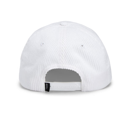 Back view of The Clubhouse by Goorin Bros., a white wide wale corduroy Papa Cap featuring an adjustable snap closure and a small black tag—an understated nod to quiet luxury.