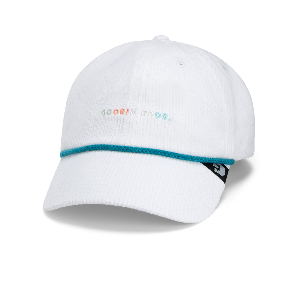 The Clubhouse by Goorin Bros. is a white baseball cap crafted from wide wale corduroy, featuring the Goorin Bros. text on the front, a teal braided band above the brim, and a black logo tag on the side. This Papa Cap embodies quiet luxury for elevated everyday style.