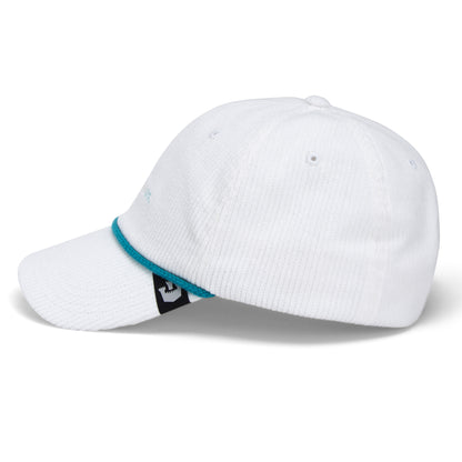 The Clubhouse by Goorin Bros. is a white baseball cap crafted from wide wale corduroy, featuring a curved brim, teal trim, and a subtle black and white side tag for an elevated touch of quiet luxury—perfectly capturing the timeless style of a classic Papa Cap. Displayed against a plain white background.