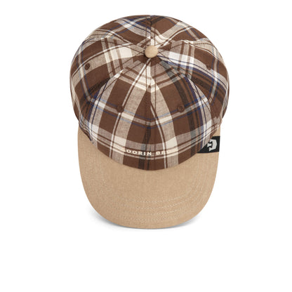 The Goorin Bros. “Ask Your Mother” cap features a brown and beige plaid pattern with a solid beige brim, shown from above on a white background.