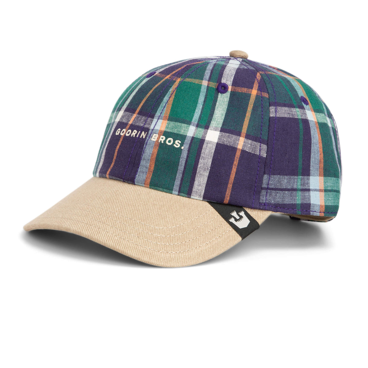A plaid baseball cap called “Hardly Working” by Goorin Bros., featuring a washed denim brim, GOORIN BROS. text on the front, and a small black tag on the side.
