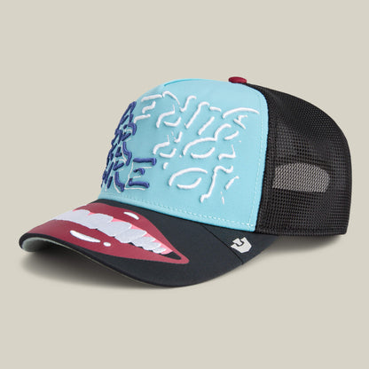 The Means Understood hat by Goorin Bros. features a blue front, white and blue abstract embroidery, black mesh back, and a bold open mouth graphic on the visor—a fun choice for confident style. All sales are final.